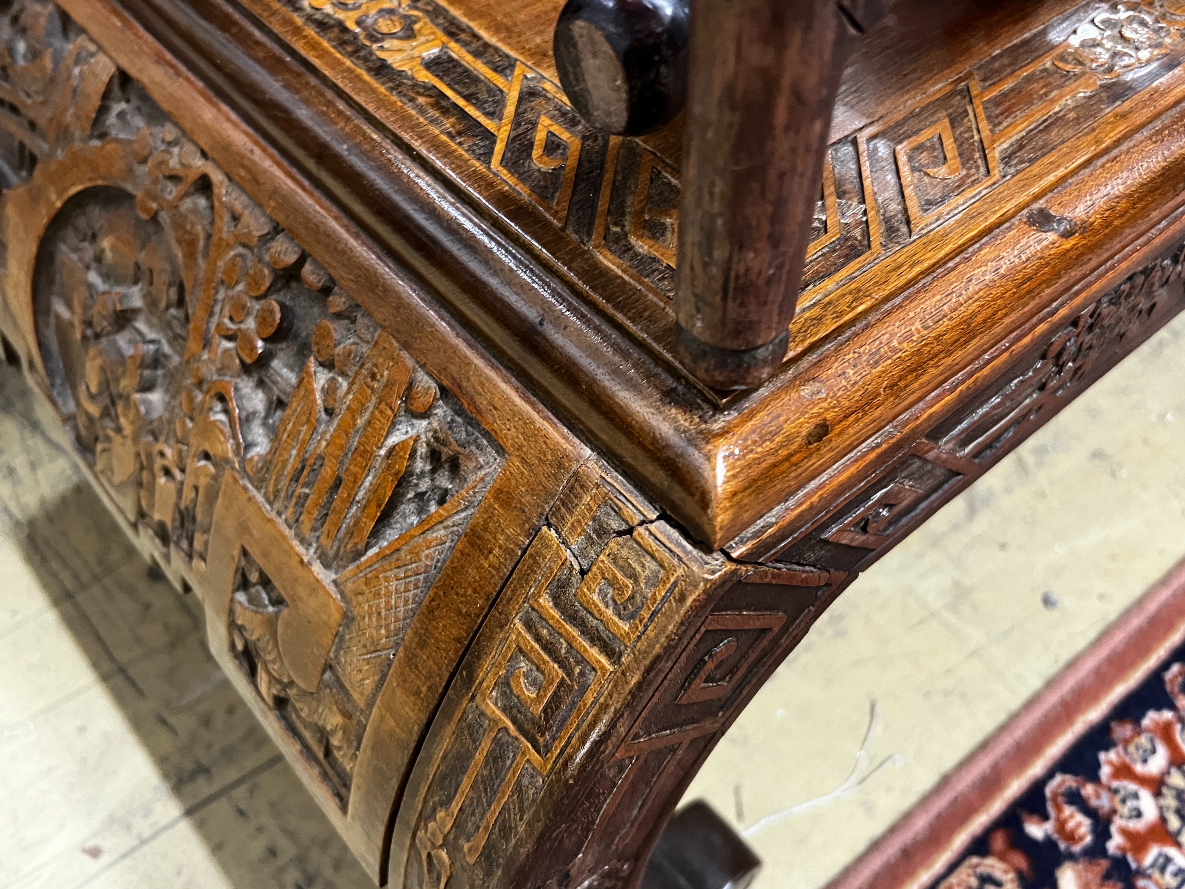 A Chinese carved hardwood low table, length 89cm, depth 43cm, height 36cm together with three Chinese carved hongmu occasional tables (one in need of extensive repair)